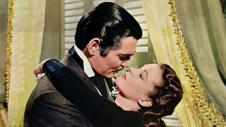 Rhett Butler and Scarlett O'Hara embracing in "Gone with the Wind" (1939)