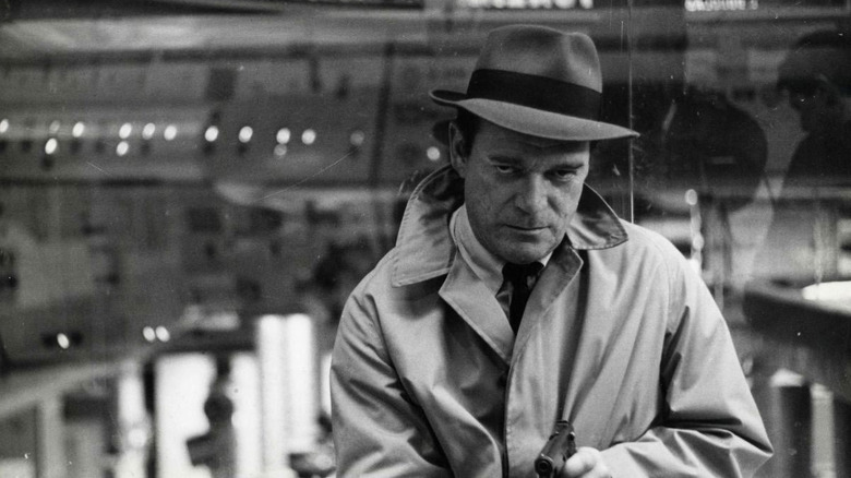 Lemmy investigating in Alphaville (1965)