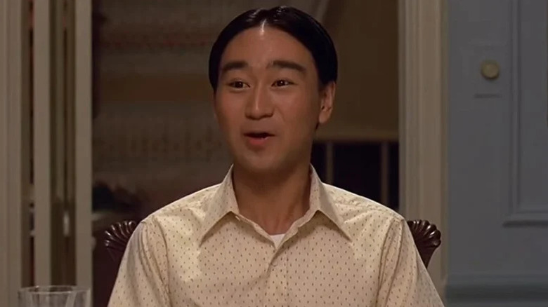 Long Duk Dong wearing a white shirt in Sixteen Candles