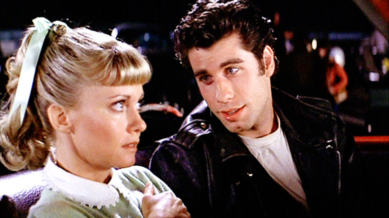 Danny talking to a horrified Sandy in the car in Grease