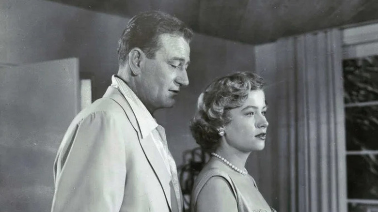 Jim McLain standing behind Nancy Vallon on Big Jim McLain