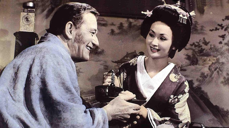 Townsend Harris and Okichi smiling and enjoying tea in The Barbarian and the Geisha