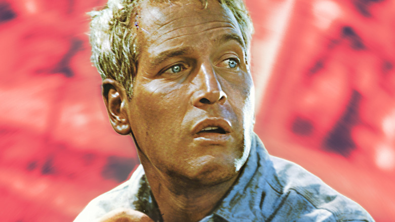 Paul Newman looking behind in trepidation against a pink background (2026)