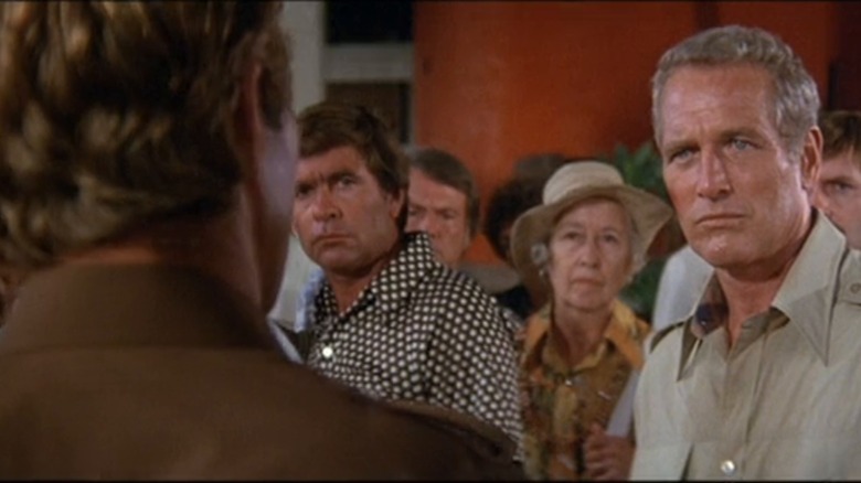 Hank Anderson looking stern in a confrontation in When Time Ran Out (1980)