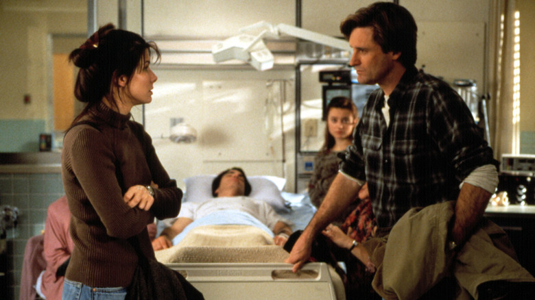 Lucy and Jack talking in Peter's hospital room in While You Were Sleeping