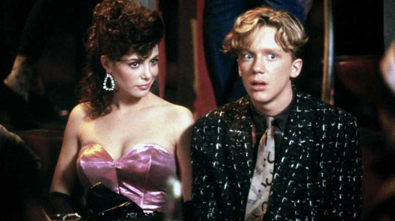Lisa sitting next to a shocked Gary in Weird Science