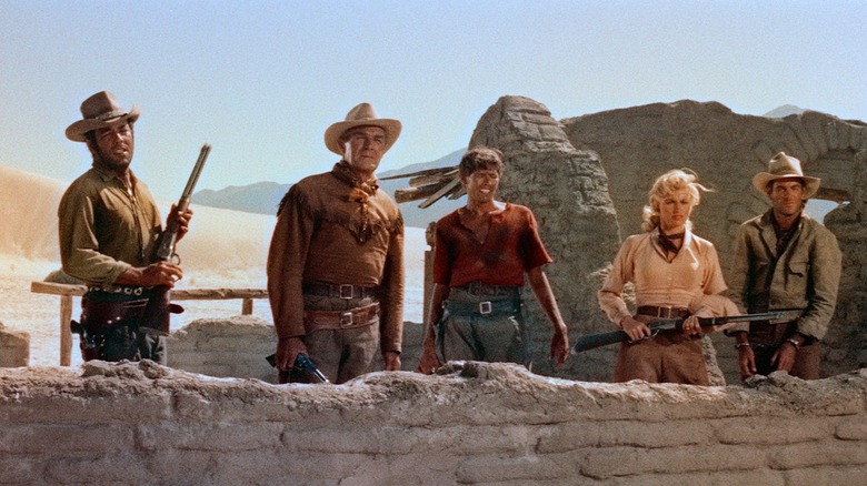 The leads of Ride Lonesome looking off into the distance