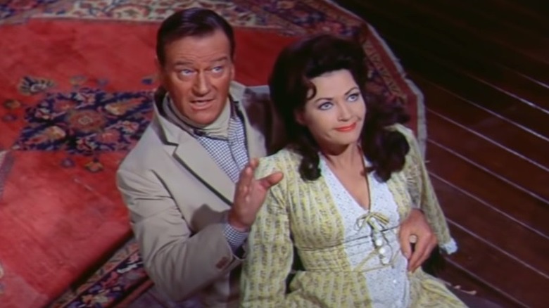 G.W. McLintock sitting with Louise Warren in "McLintock!" (1963)