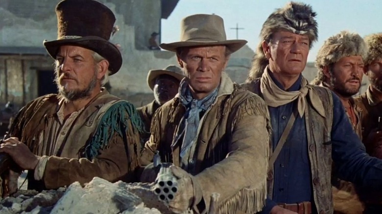 Davey Crockett and Jim Bowie look for the enemy in "The Alamo" (1960)