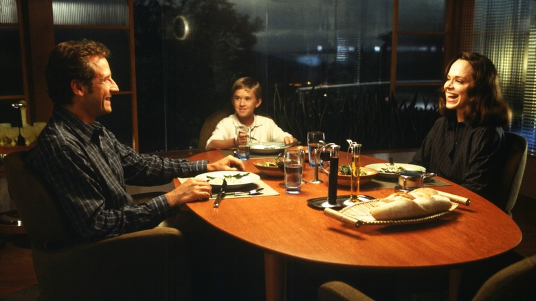 David uncomfortably laughing with his human family in A.I. Artificial Intelligence (2001)