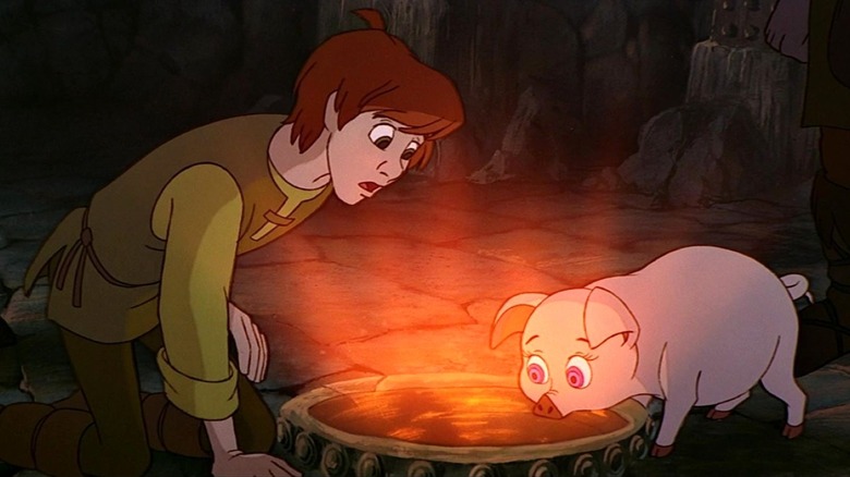 Hen Wen uses water to see the future while Taran watches in The Black Cauldron (1985)