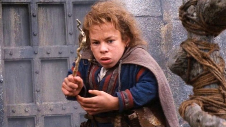 Willow stands while holding his wand in Willow (1988)