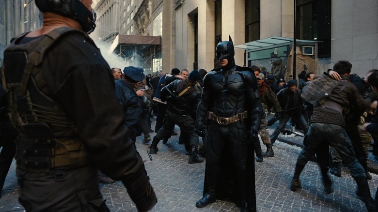 Batman staring at Bane in "The Dark Knight Rises" (2012)