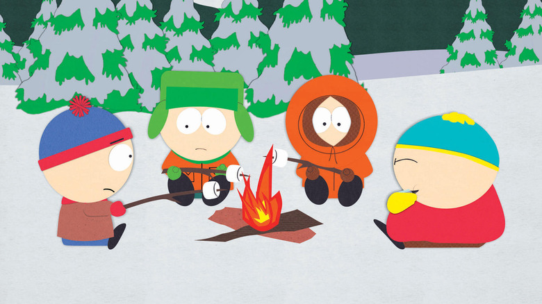 Stan, Kyle, Kenny, and Cartman roasting marshmallows on a fire in "South Park"