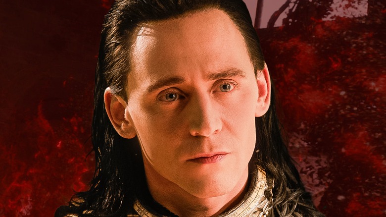 A judgy Loki peers cockily upward, backed by Scarlet Witch red spatter
