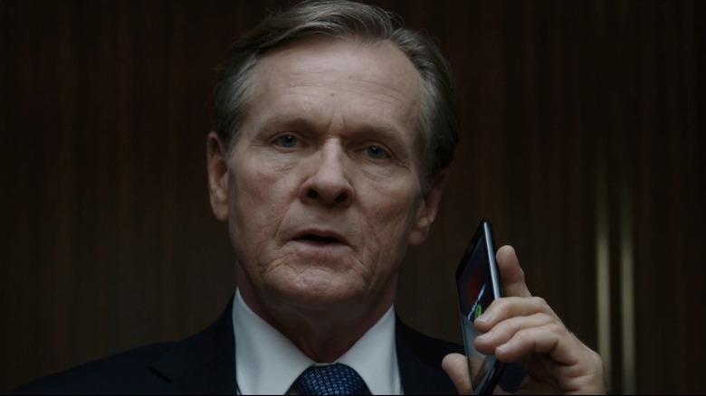 President Ellis witnessing a hostage situation in Iron Man 3 (2013)