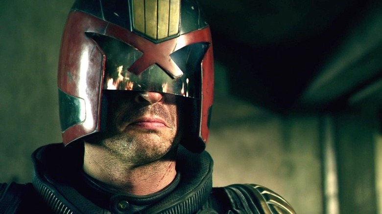 Judge Dredd watching a fire in Dredd