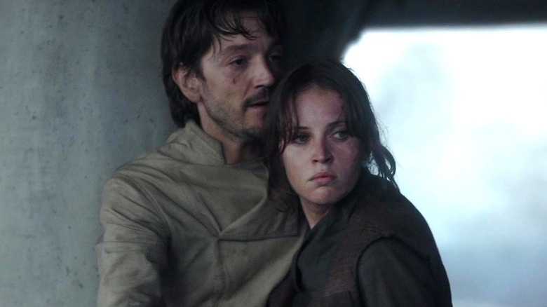 Cassian Andor and Jyn Erso looking to the side in Rogue One