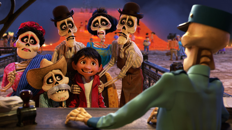 The whole Rivera family surrounds Miguel in "Coco" (2017)