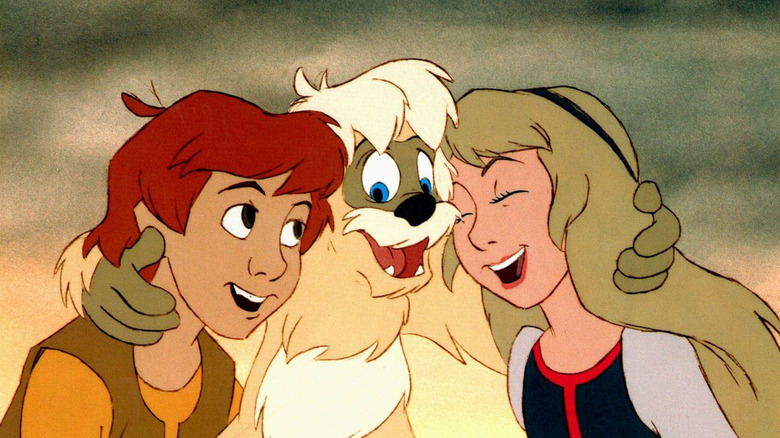 Taran, Princess Eilonwy, and Gurgi embrace in "The Black Cauldron" (1985)