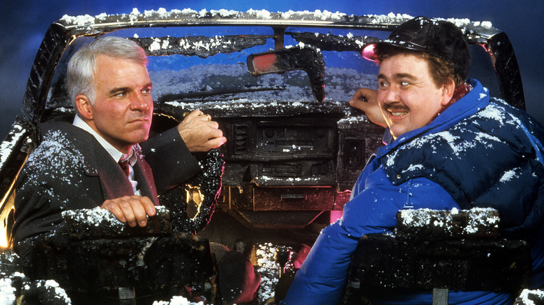 Neal glaring at a smiling Del in "Planes, Trains and Automobiles" (1987)