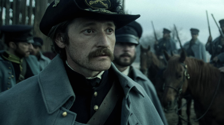 Captain Edmund Dellinger looking perturbed in American Primeval (2025)