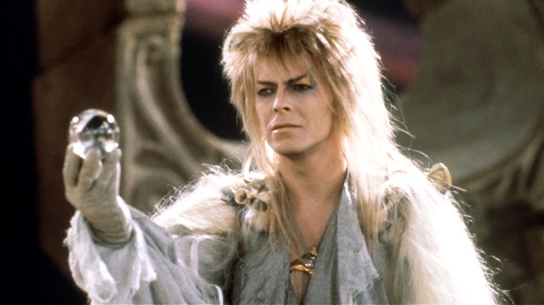 Jareth holding a glass sphere in 