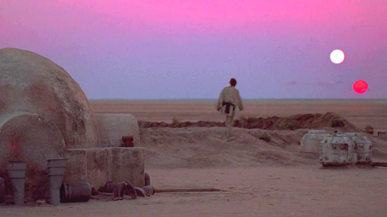 Luke Skywalker walking towards the sunset on Tatooine in "Star Wars"