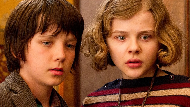 Hugo and Isabelle looking shocked in Hugo (2011)