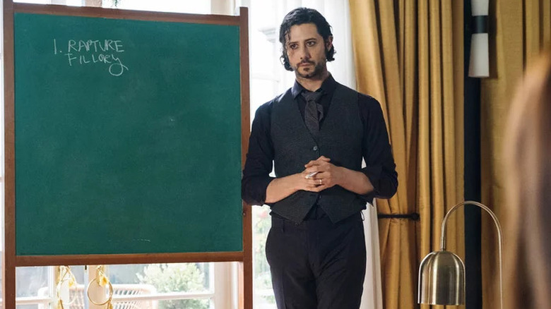 Eliot Waugh standing by a blackboard on "The Magicians" (2015-2020)