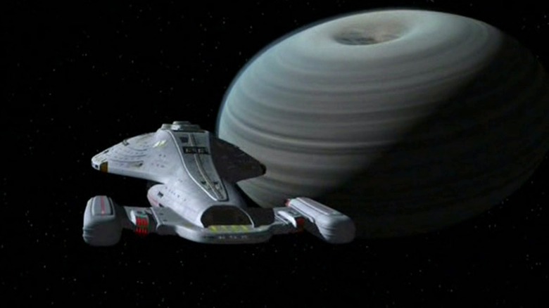 The USS Voyager approaching a strange planet in "Star Trek: Voyager"