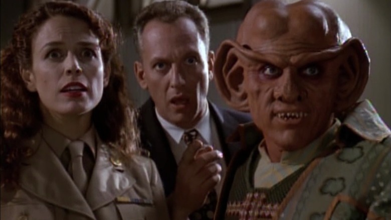 Quark standing beside two humans in the '50s in "Star Trek: Deep Space Nine"