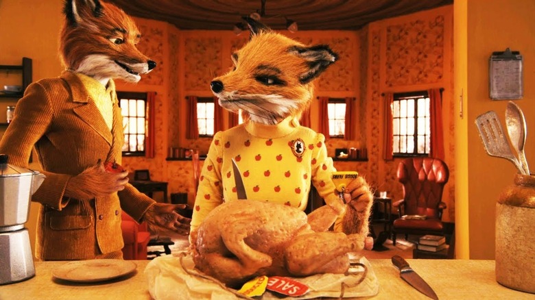 Mr. Fox and Mrs. Fox standing over a freshly roasted chicken in Fantastic Mr. Fox
