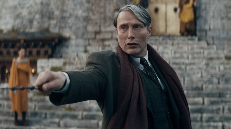 Gellert Grindelwald raising his wand in "Fantastic Beasts: The Secrets of Dumbledore."