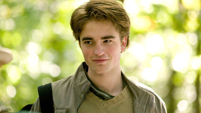 Cedric with a backpack over his shoulder smiling in Harry Potter and the Goblet of Fire