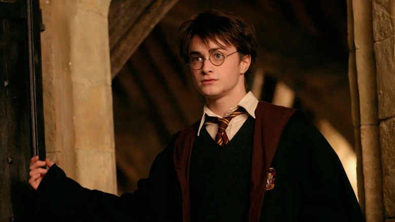 Harry looking worried walking through a doorway in Harry Potter and the Prisoner of Azkaban