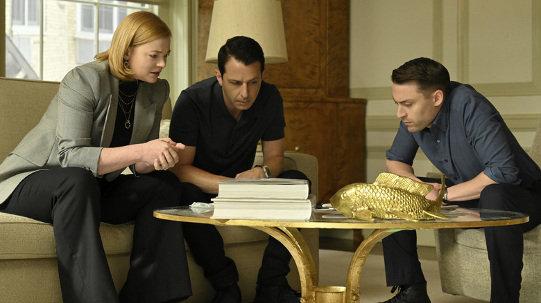 Shiv Kendall and Roman on a conference call on Succession