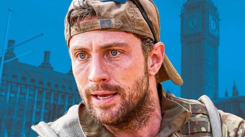Major Will Tranter looking intensely in Fuze (2025) in front of blue London background