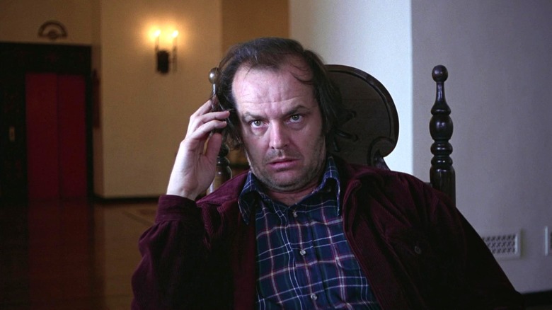 Jack Torrance holding his head in The Shining