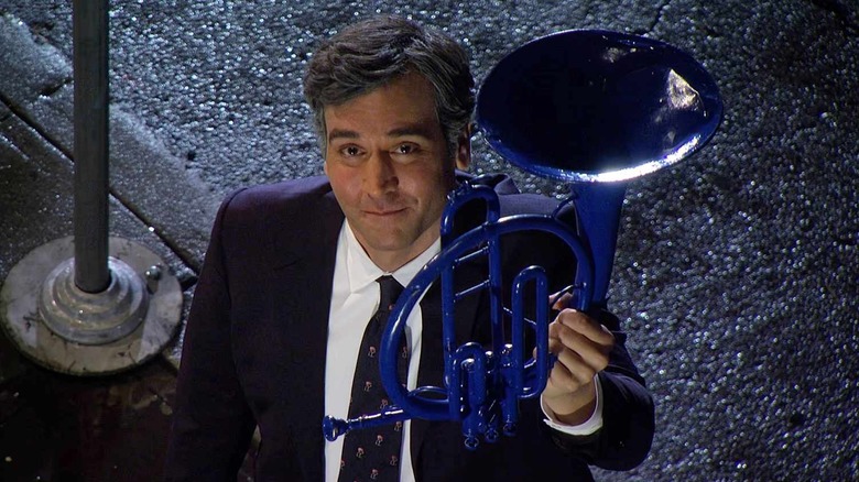 Ted holding up the blue French horn on How I Met Your Mother
