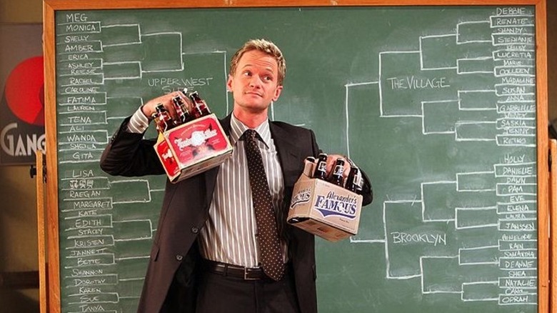 Barney holding up six-packs in front of the bracket on How I Met Your Mother