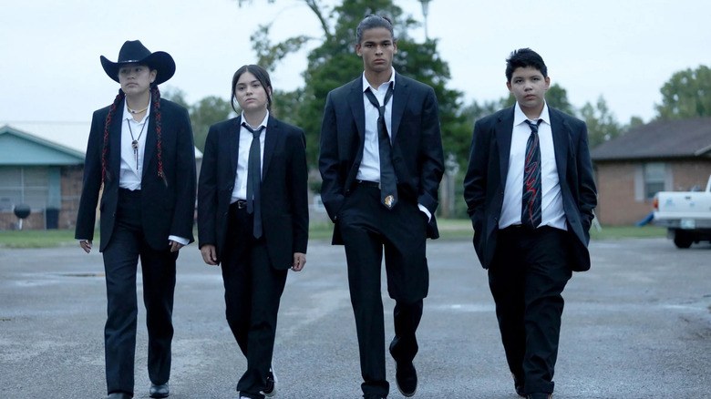 Willie Jack, Elora Danan, Bear Smallhill, and Cheese walking in their suits on Reservation Dogs
