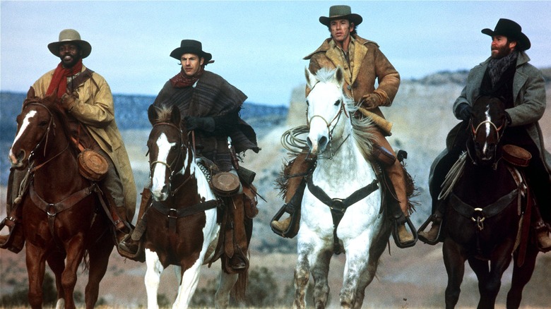 Mal, Jake, Paden, and Emmett riding horses in Silverado