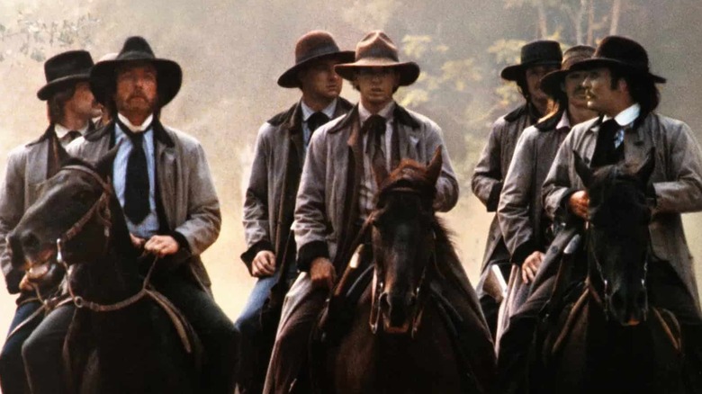 A gang rides on horseback in 'The Long Riders' (1980)