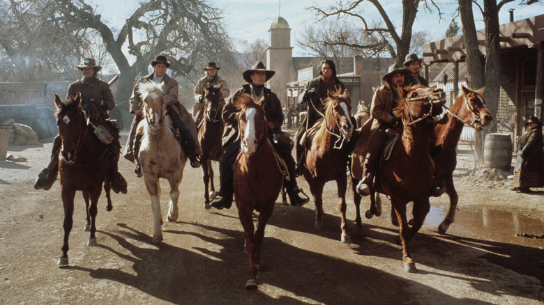 Cowboys in into town in 'Young Guns' (1988)