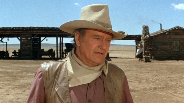 Will Andersen (John Wayne) standing in the desert in "The Cowboys."
