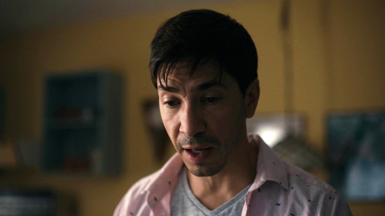 AJ looking down in "Barbarian" (2022)