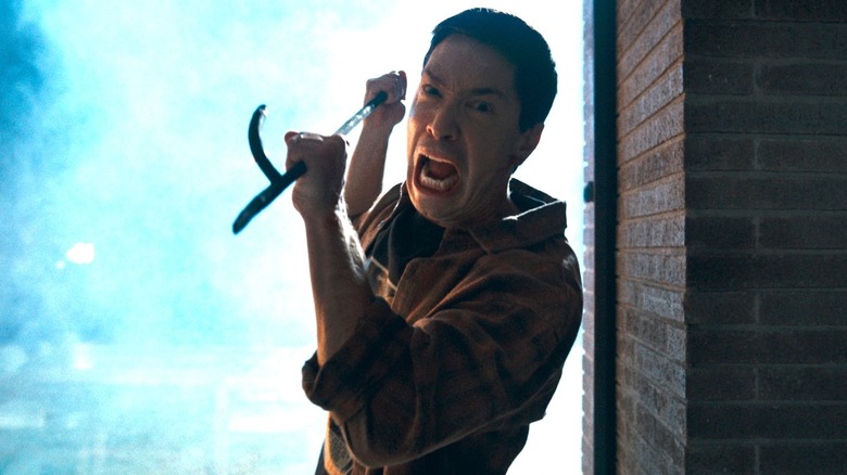 Scott holding a weapon in "Coyotes" (2025)