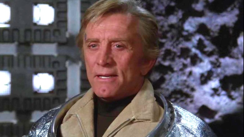 Adam standing in a space ship in Saturn 3