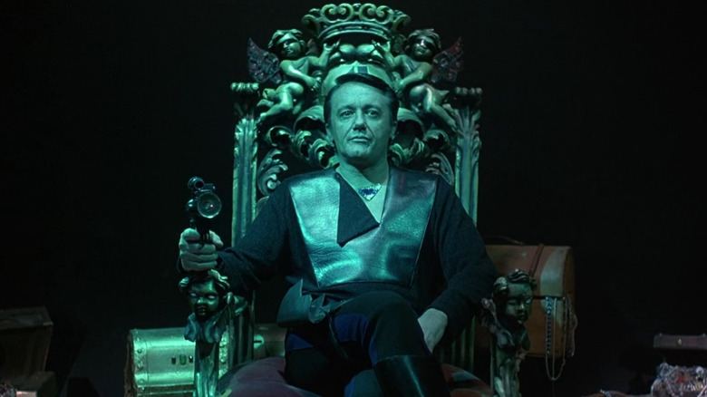 Gelt sitting on a throne in Battle Beyond the Stars